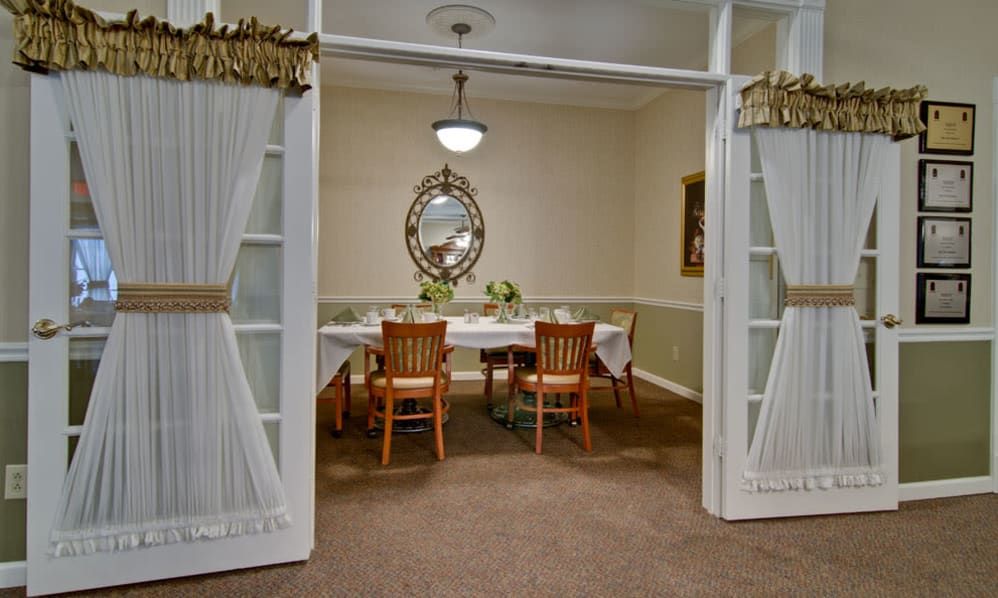 Senior living community, Park View Meadows, showcasing elegant architecture, dining room decor.