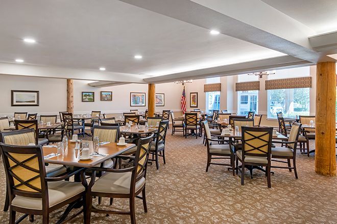 Interior view of Brookdale Twin Falls senior living community featuring dining room and lounge area.