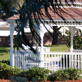 Outdoor view of Hawthorne Inn of Brandon senior living community with gazebo and architecture.