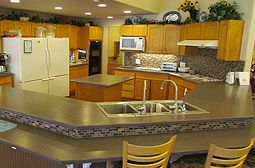 Interior view of Guardian Angel Homes senior living community featuring a well-equipped kitchen.