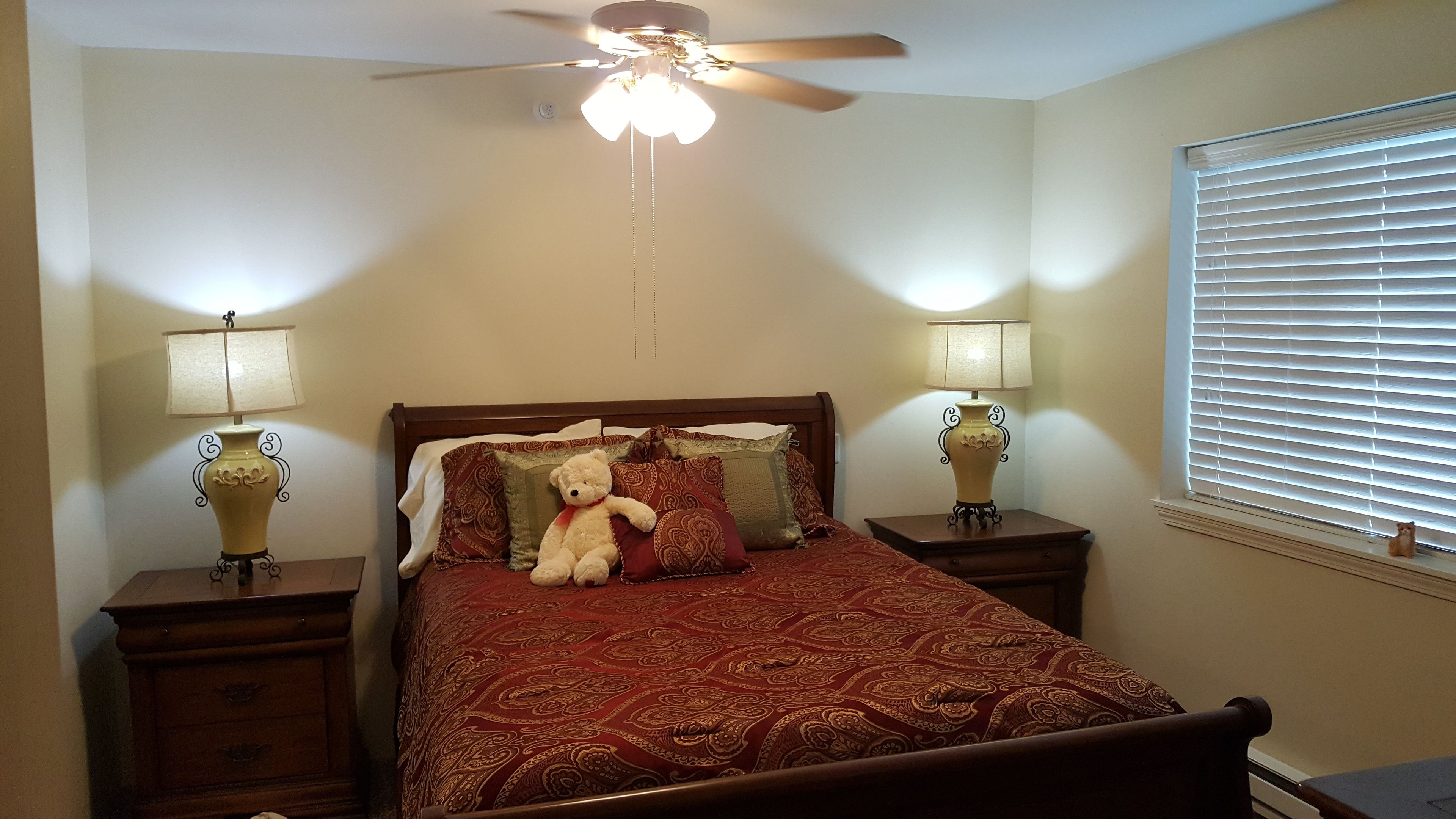 Interior view of a furnished bedroom at Solstice Senior Living At Lees Summit with modern decor.
