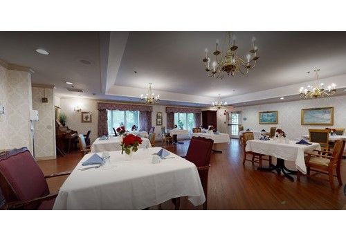 Senior living community at Walpole Healthcare featuring elegant architecture, dining room, and decor.
