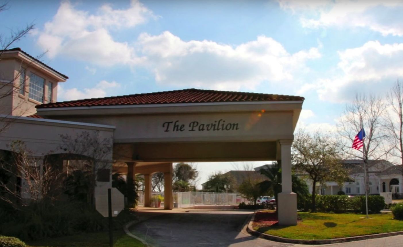 Architectural view of BayView Assisted Living Pavilion with lush greenery outdoors.