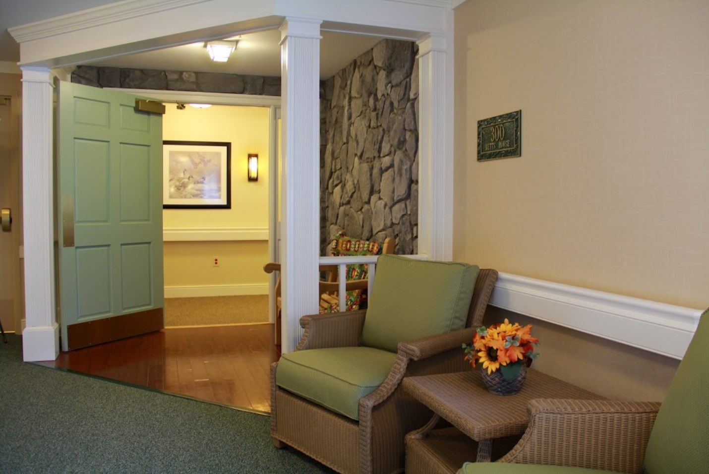 Interior of Olney Memory Care, a senior living community, featuring cozy living room decor.