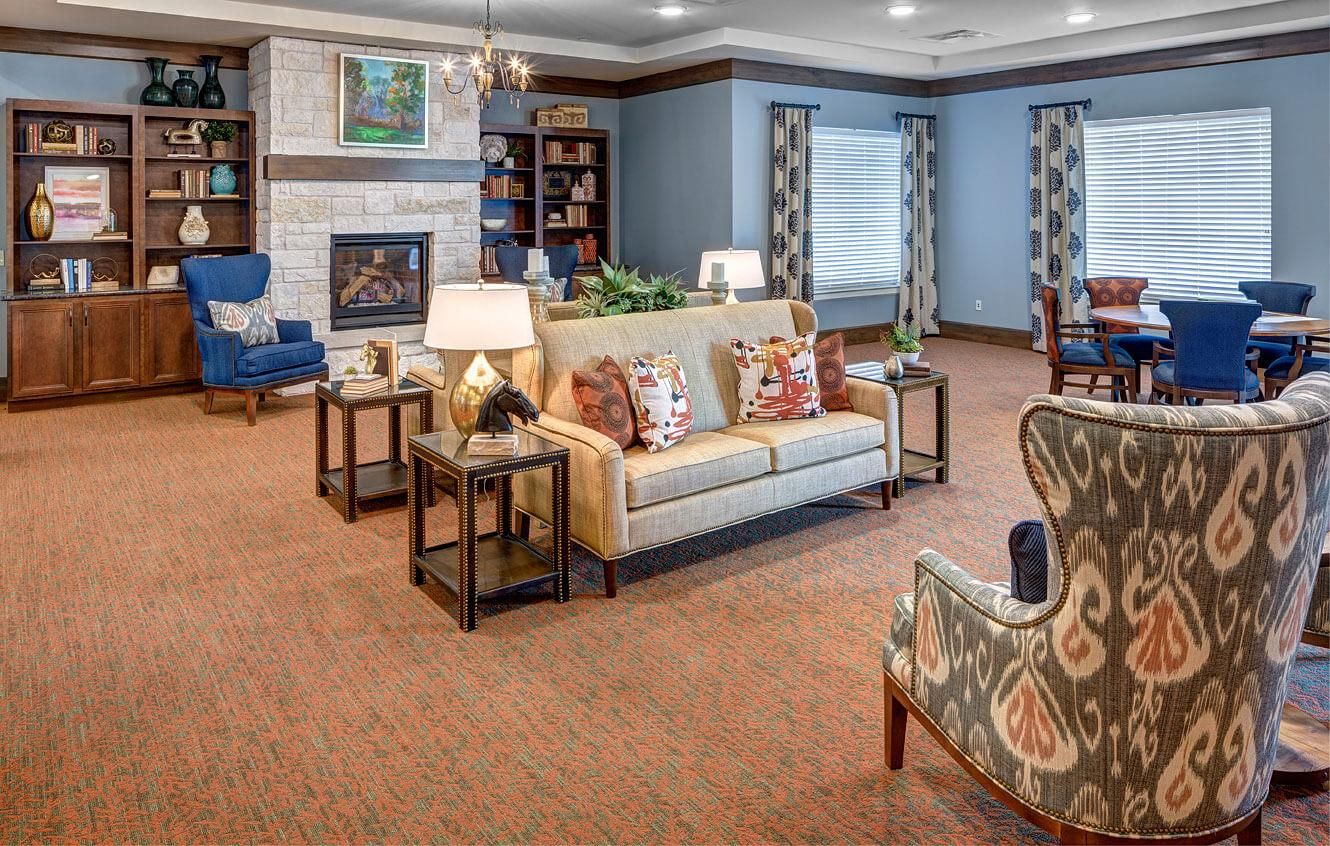 Senior living room at The Delaney At Georgetown Village featuring cozy furniture and decor.