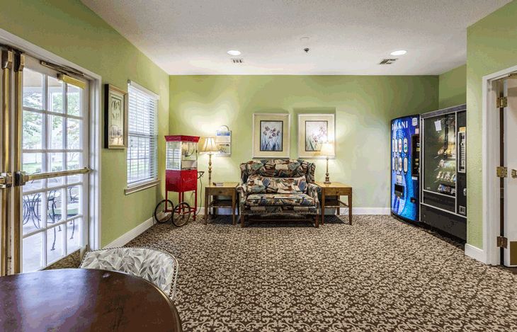 Interior view of American House Bartlett senior living community featuring decor, furniture, and amenities.