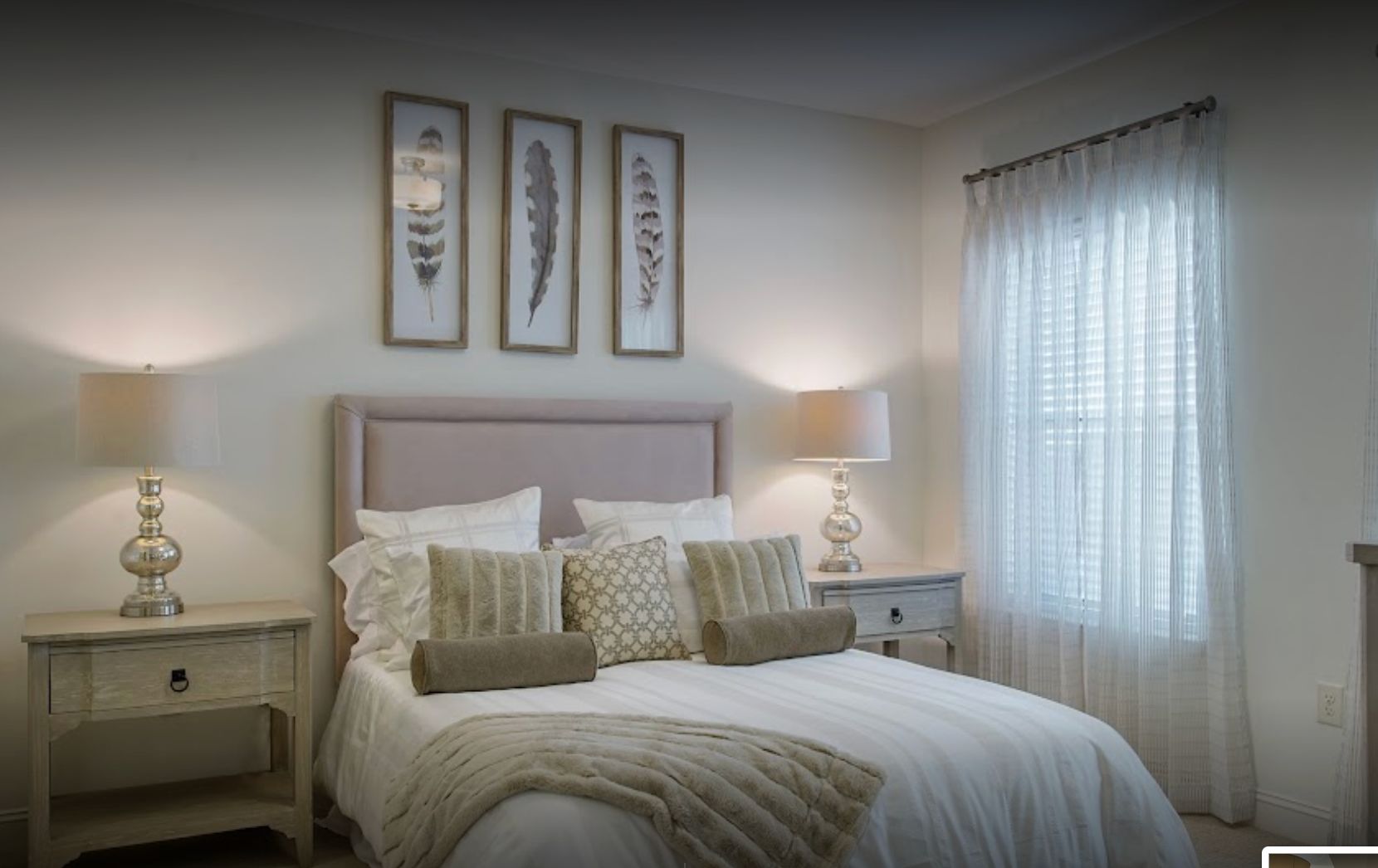 Interior design of a bedroom at Somerby Franklin senior living community with art and decor.