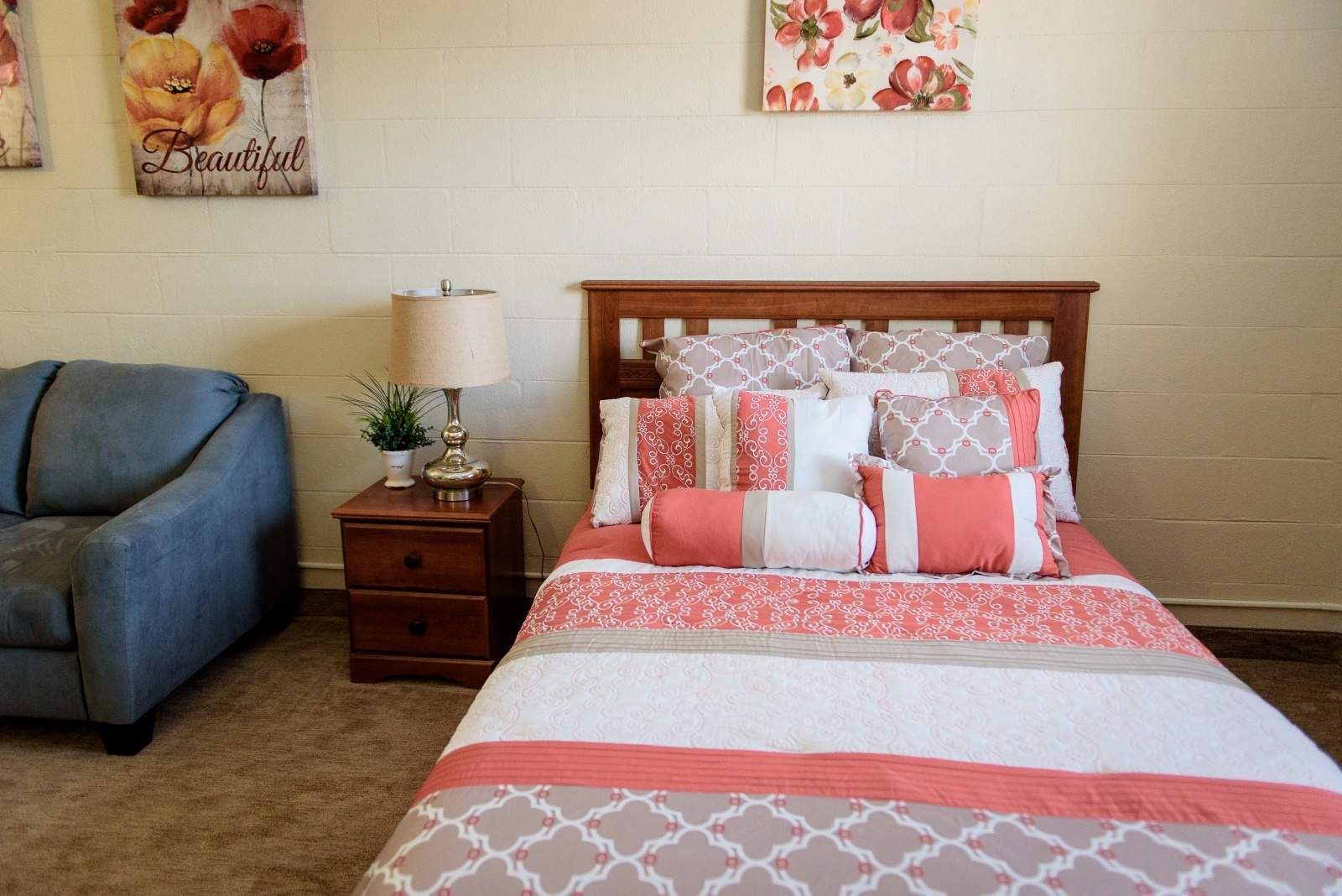 Vintage Care senior living community bedroom with cozy furniture and home decor.