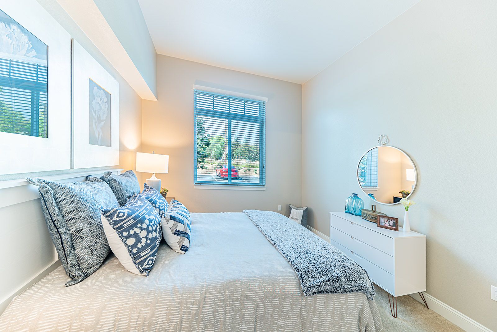 Interior view of a cozy bedroom at Allara Senior Living with stylish decor and furniture.