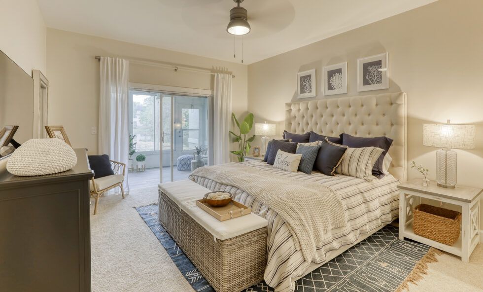 Interior view of a cozy bedroom in Unisen Senior Living community with modern decor and architecture.