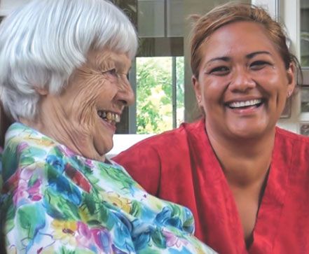 Happy senior woman laughing and smiling in Oceanside Hawaii Assisted Living & Memory Care community.