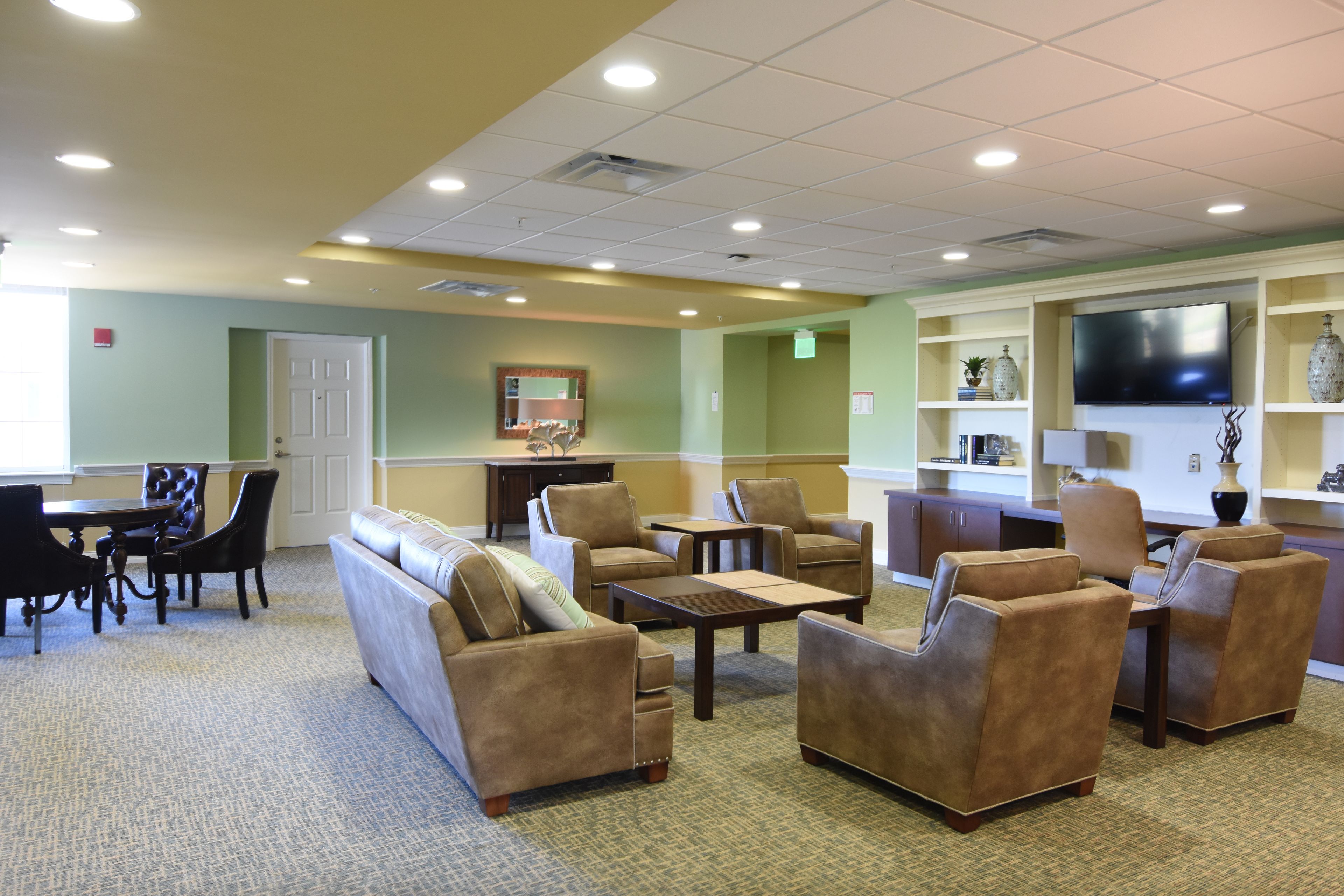 Senior living room interior at Silver Creek with modern furniture, electronics, and decor.
