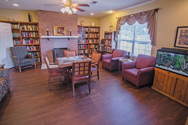 Interior view of Monarch Place senior living community featuring a well-furnished living and dining room.