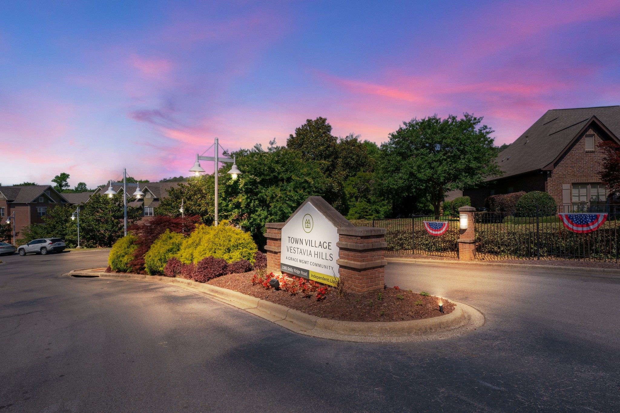 Senior living community in Vestavia Hills with urban architecture, vehicles, and nature.