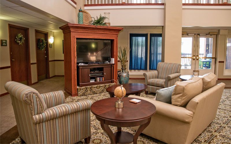 Interior design of Bickford of Peoria senior living room with modern decor, electronics, and furniture.