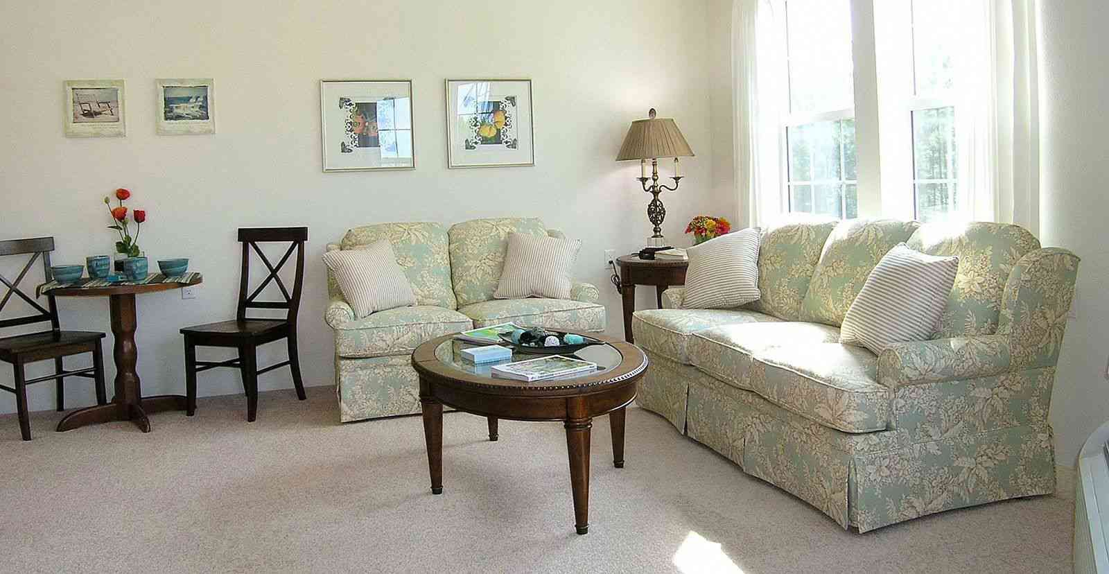 Senior living community room at Las Palmas featuring cozy furniture, home decor, and architecture.