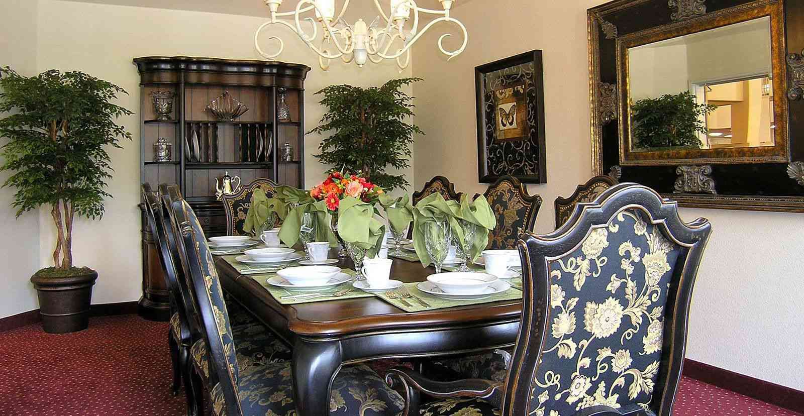 Interior view of Las Palmas senior living community featuring dining room with elegant decor.