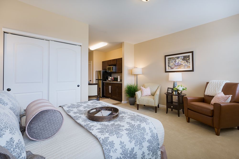 Interior view of Three Oaks Assisted Living and Memory Care featuring cozy living room and bedroom decor.