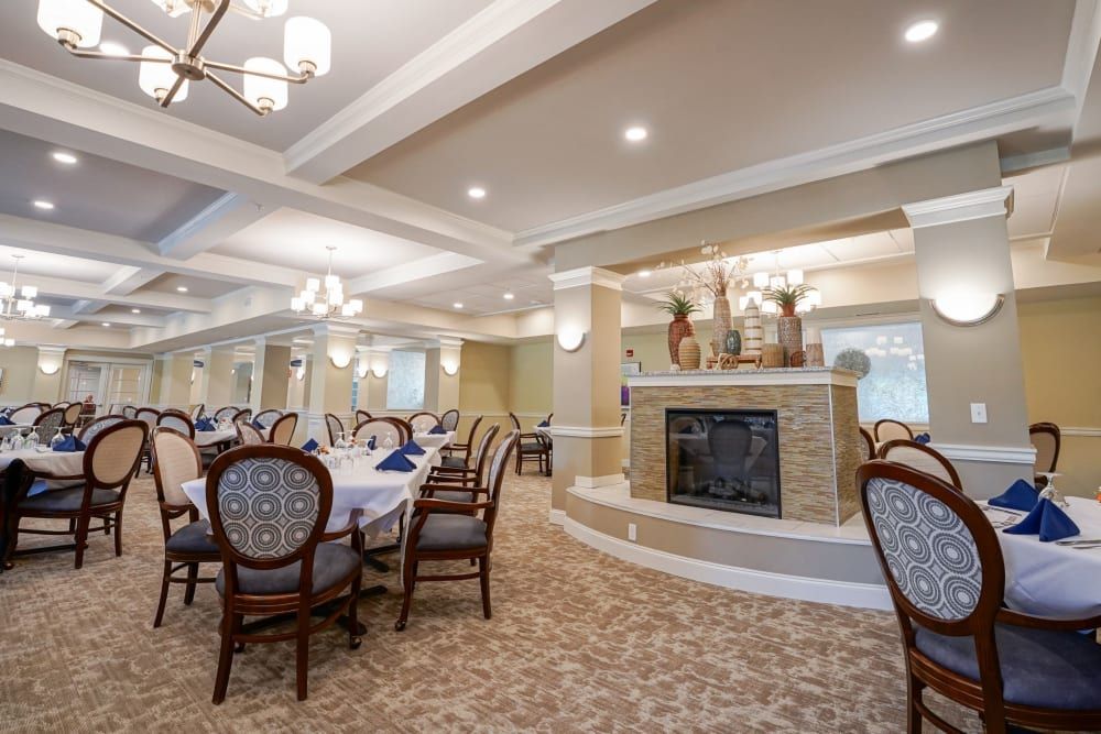 Senior living community Harmony At Bellevue featuring dining room with table, chairs, and home decor.