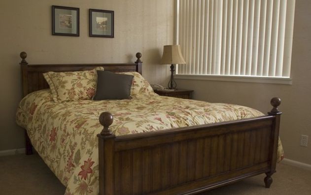Interior view of a cozy bedroom in Bed, Furniture, Indoors senior living community.
