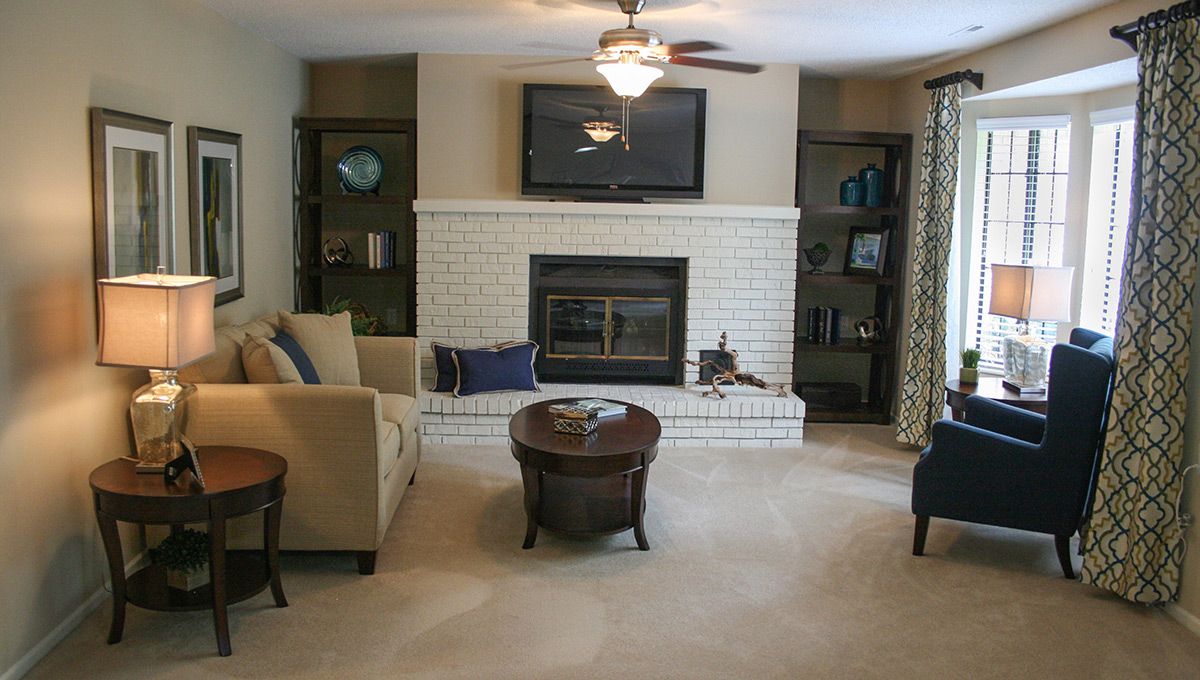 Interior view of Foxwood Springs senior living room with modern furniture and electronics.