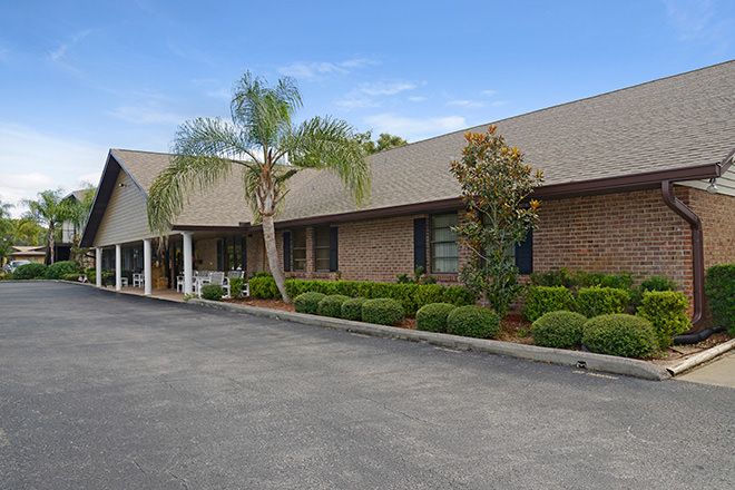 Brookdale New Port Richey senior living community with lush gardens and modern architecture.