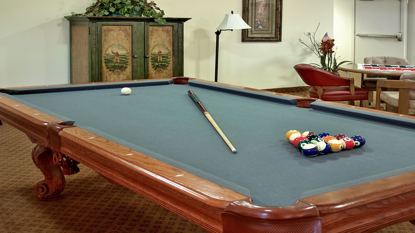 Senior living community Rocky Ridge featuring a furnished billiard room with pool table.