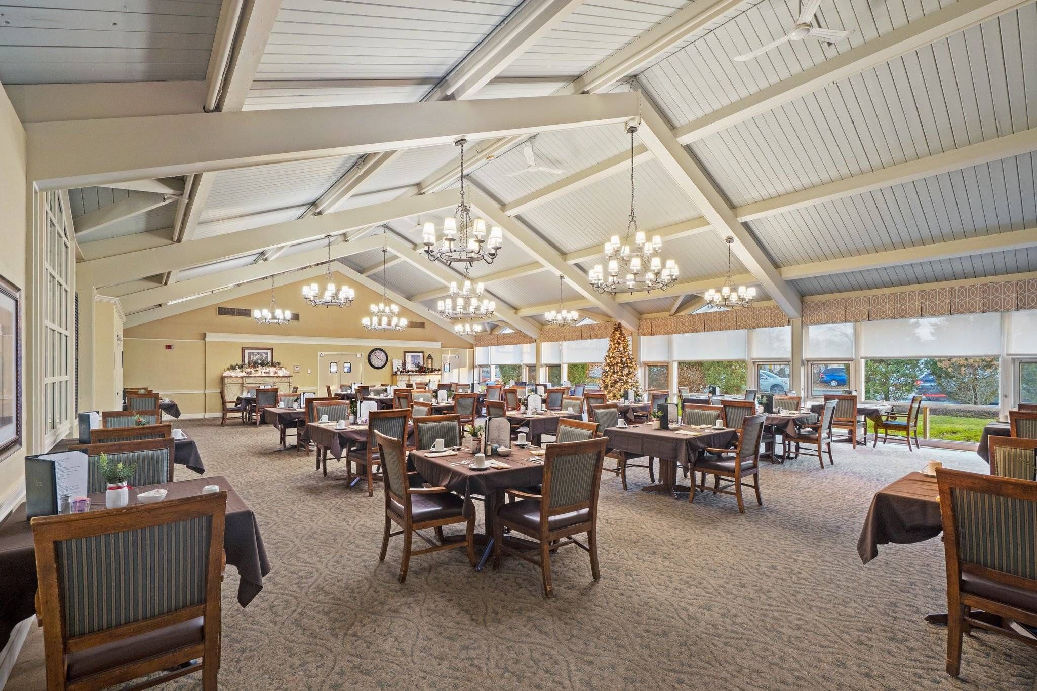 Senior living community cafeteria at Halcyon at West Bay featuring modern architecture and decor.