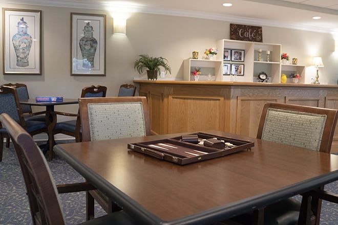 Interior view of Brookdale Highlands senior living community featuring dining area and art.