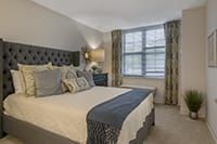 Interior view of a well-furnished bedroom at Brookdale Lisle senior living community.