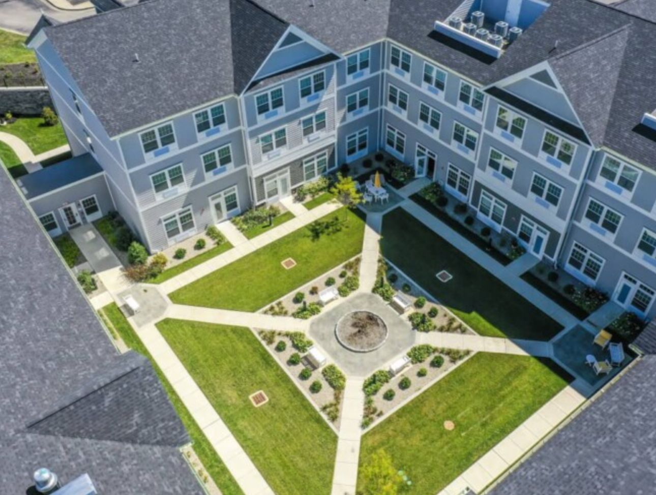 Aerial view of Quincy Place Senior Living community showcasing its architectural design.