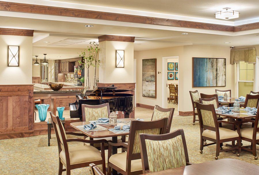 Interior view of MorningStar senior living community in Fort Collins featuring dining room and kitchen.