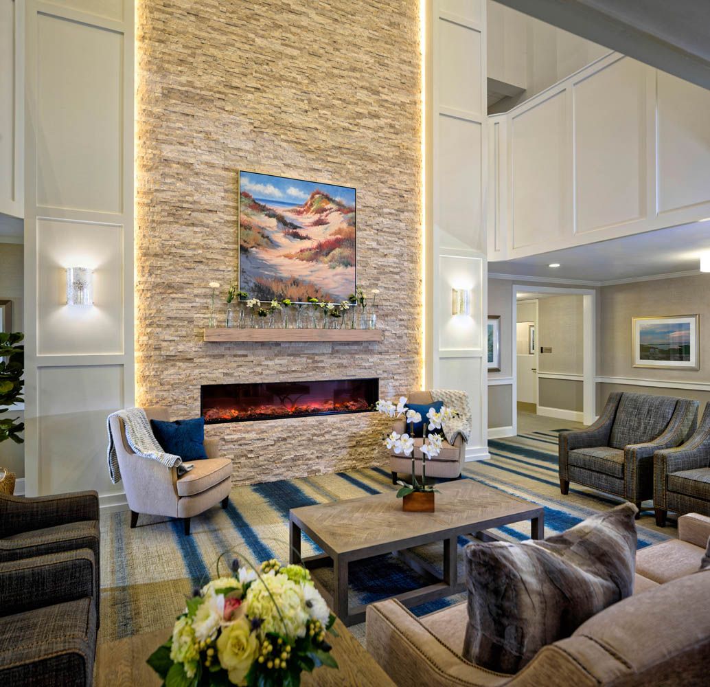 Interior view of Maplewood at Mayflower Place senior living room with elegant decor and fireplace.