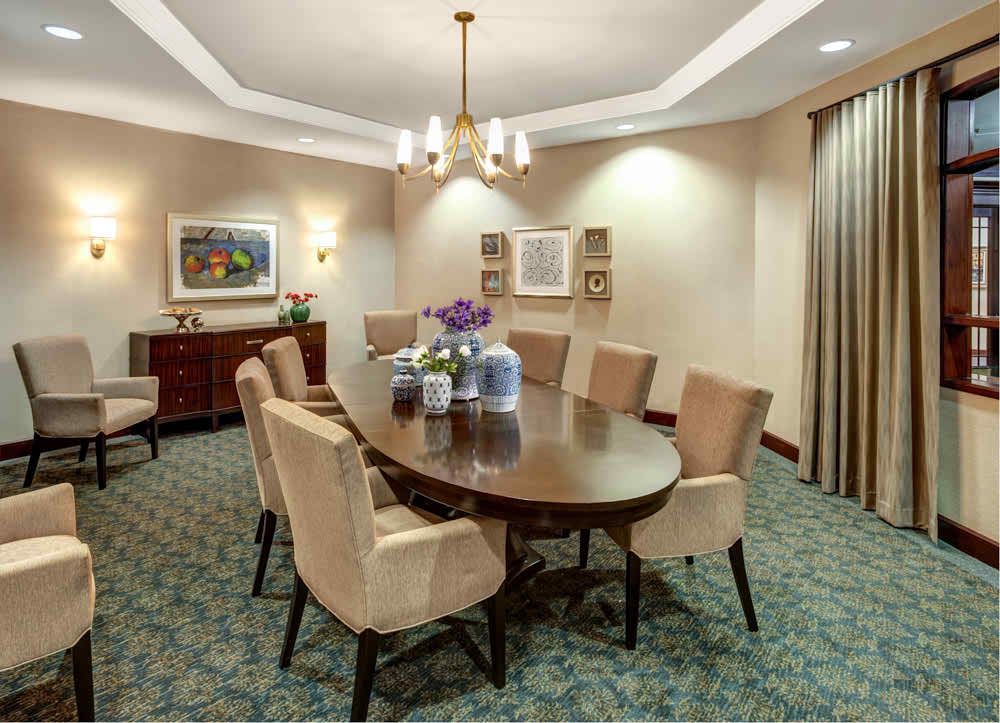 Interior view of Lincolnwood Place senior living community featuring dining room with elegant decor.