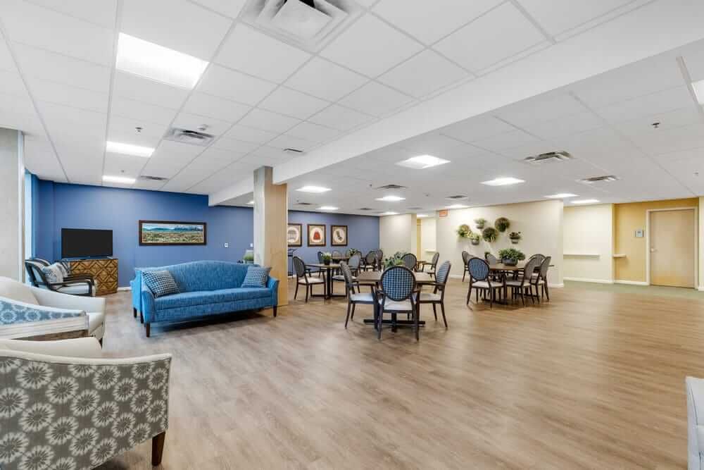 Indoor view of Baxter Senior Living community featuring modern architecture, furniture, and electronics.
