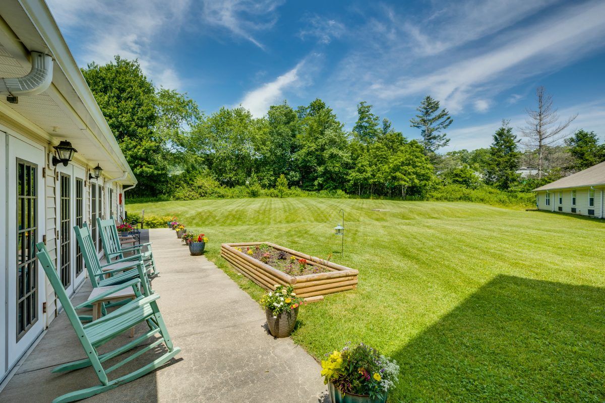 Senior living community, Deerfield Ridge, featuring lush gardens, cozy interiors, and beautiful architecture.