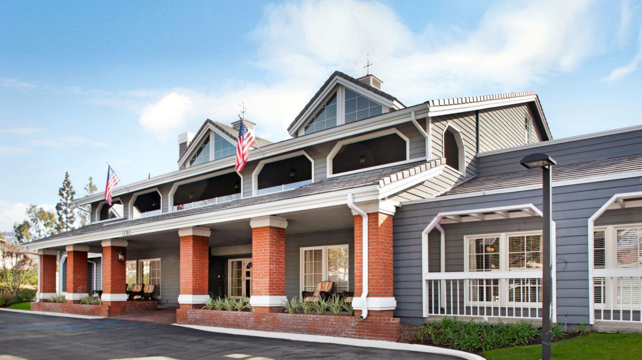 Senior living community Ivy Park at Bradford, Placentia featuring row houses and portico architecture.