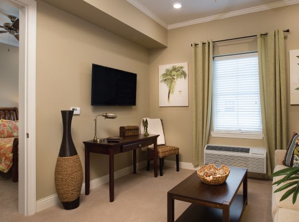 Interior view of Legacy At Highwoods Preserve senior living community featuring modern decor and electronics.