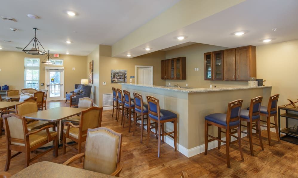 Interior view of Keystone Place At Terra Bella senior living community featuring dining and kitchen areas.