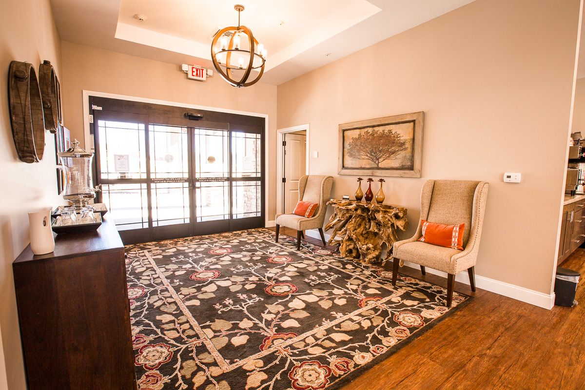 Home Decor and architecture of a senior living community with wooden furniture and chandeliers.