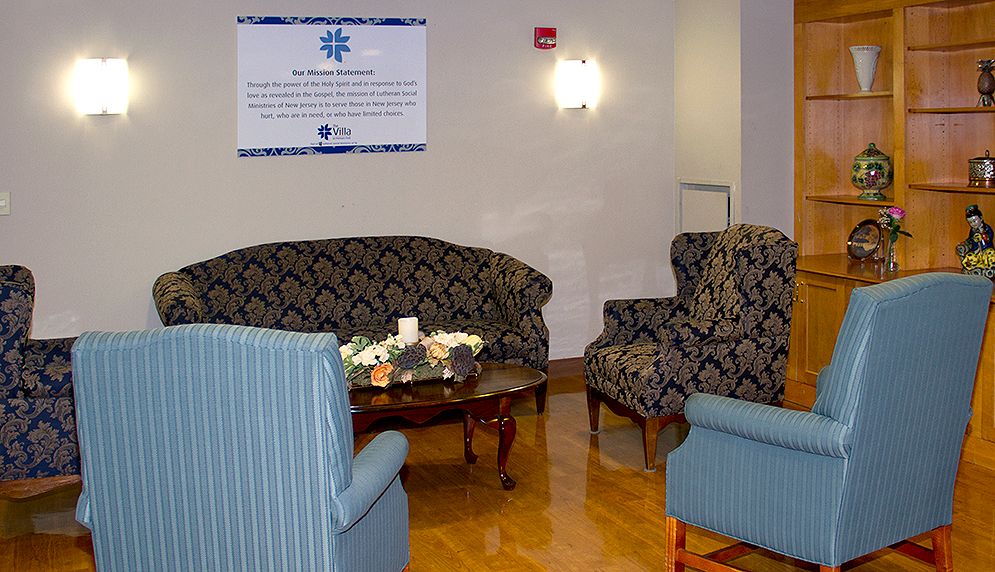 Interior view of The Villa At Florham Park senior living community with stylish furniture.