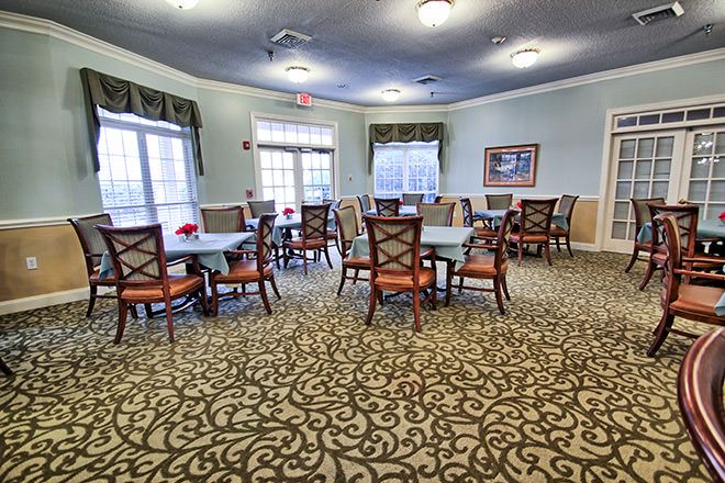 Interior view of Brookdale New Hope senior living community featuring dining and reception areas.