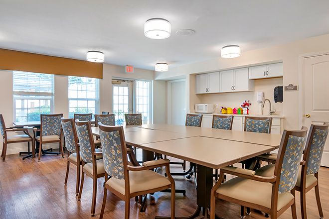 Interior view of Brookdale Twin Falls senior living community featuring dining room with wooden furniture.