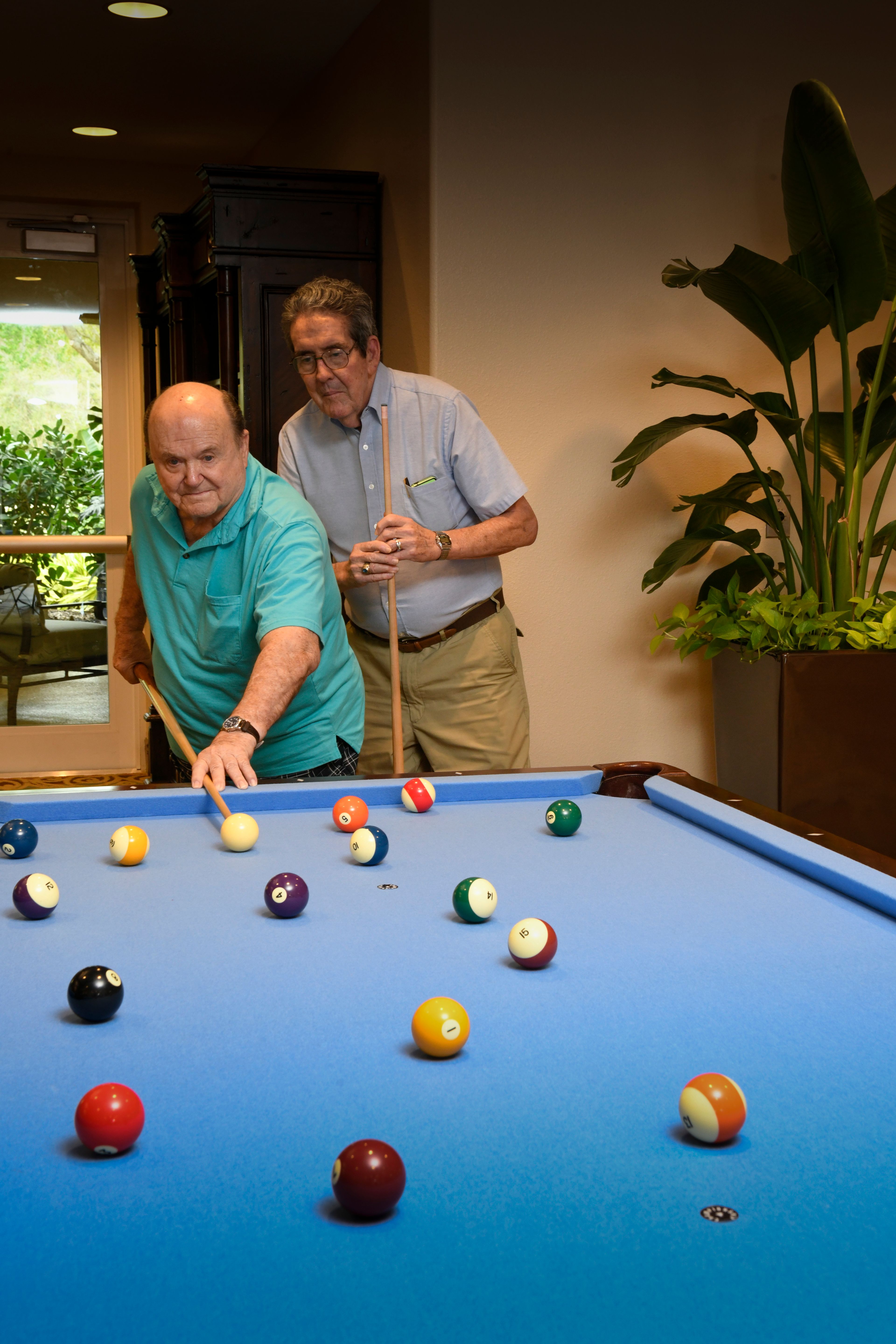 Many residents enjoy a game of pool inside