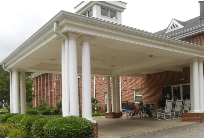 Senior living community at Sylacauga Health and Rehab Services with architectural buildings.