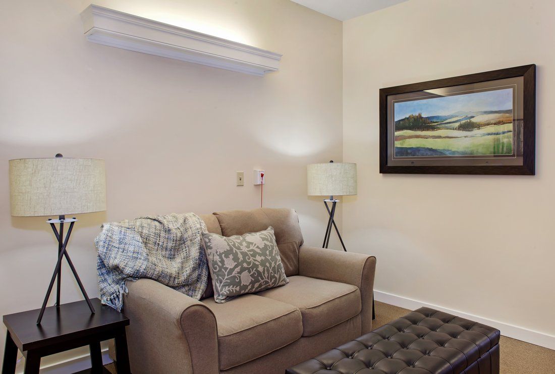 Senior living community Sunrise of Lenexa featuring cozy living room with modern decor.