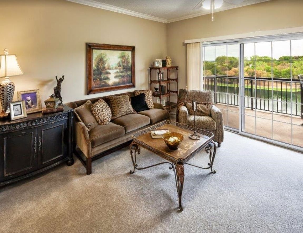 Senior living room interior at Lakeview Village with elegant furniture and art decor.