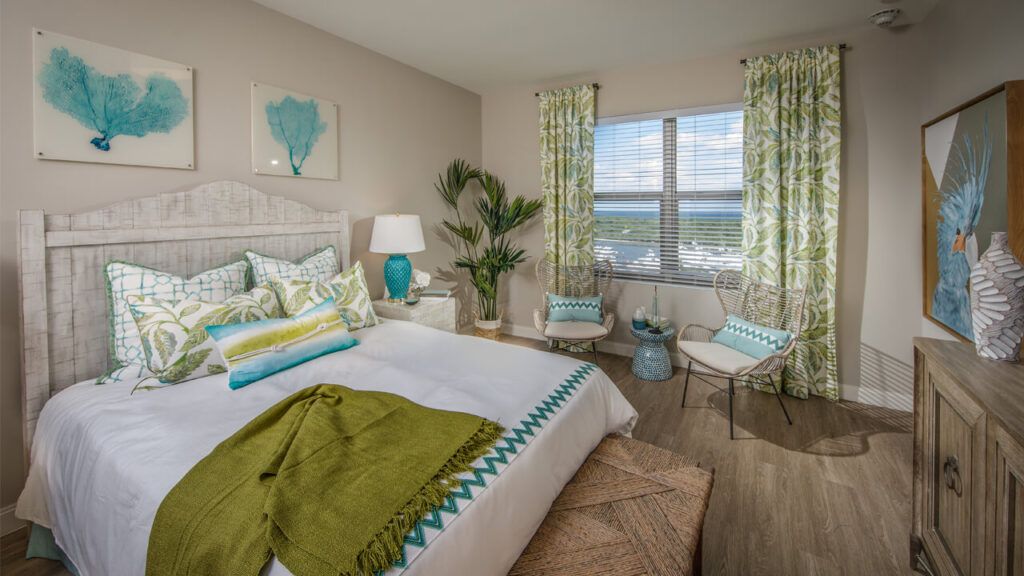 Interior view of a cozy bedroom at Belmont Village Senior Living in Fort Lauderdale.