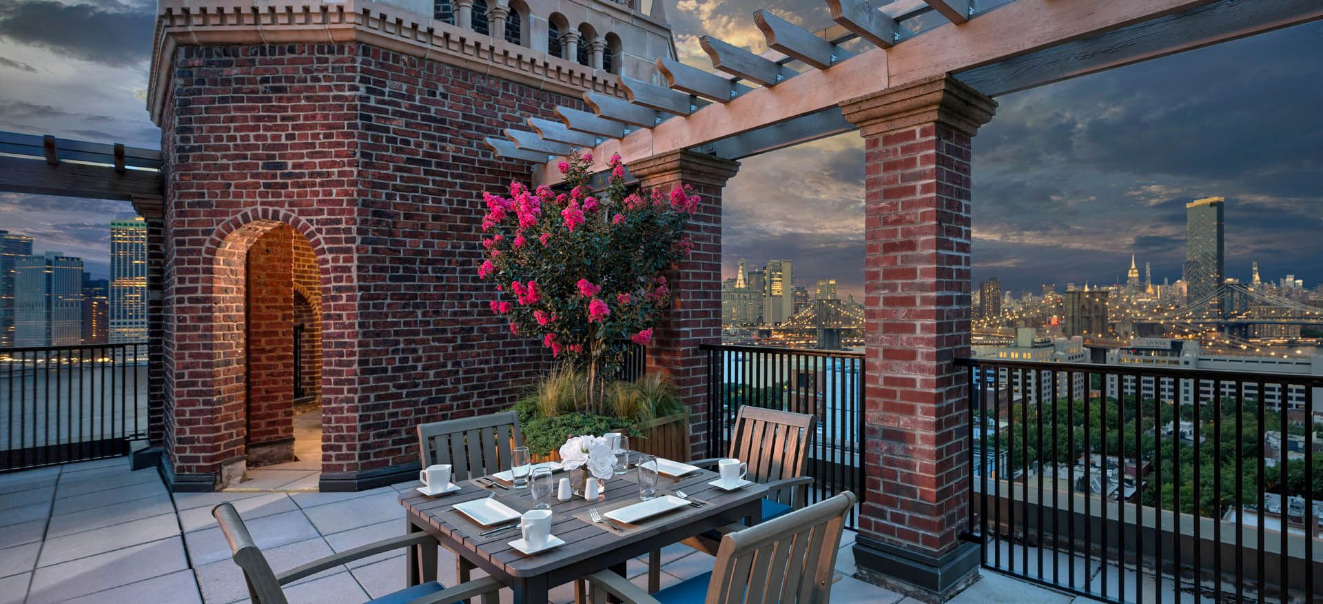 Senior living community, The Watermark at Brooklyn Heights, showcasing outdoor scenery, architecture, and dining area.