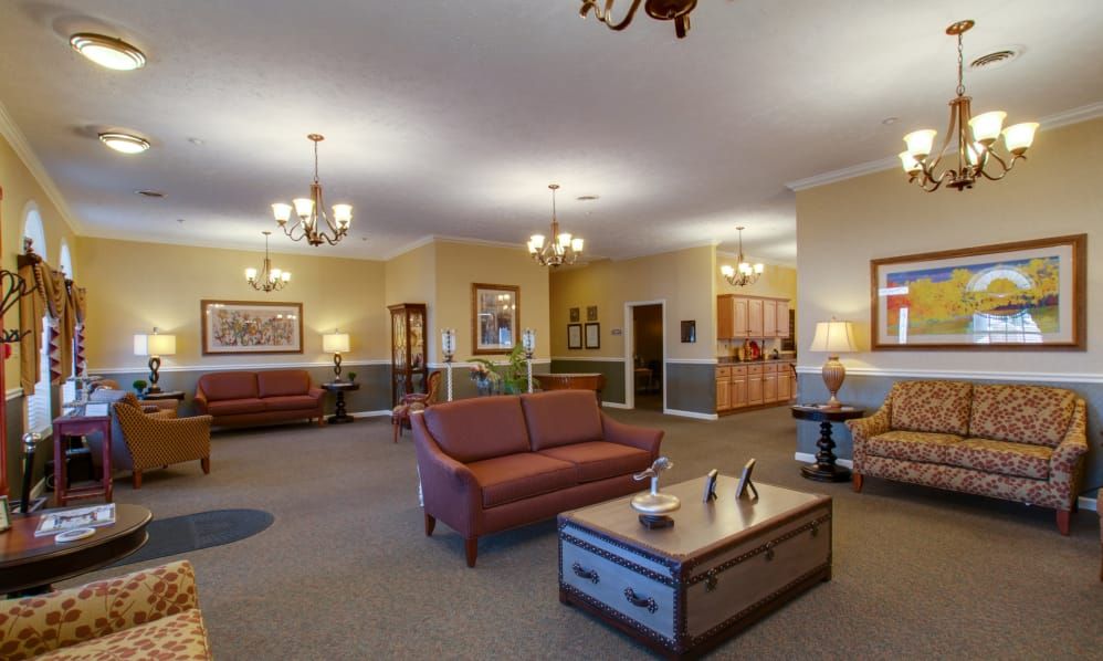 Senior living community reception room at River Wick featuring elegant furniture and art.